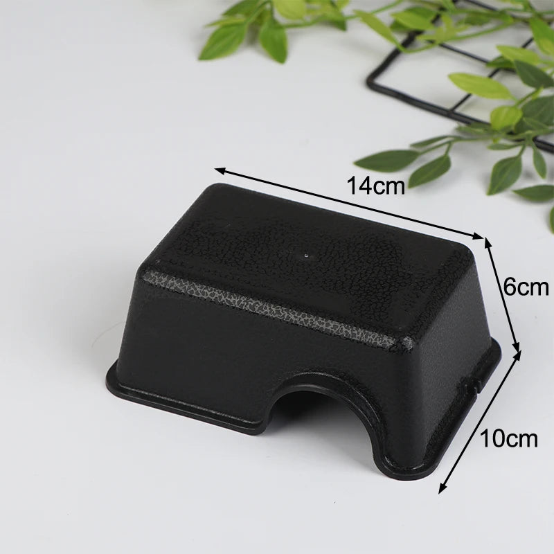 Black reptile hide box enclosure with dimensions 14cm by 6cm and a depth of 10cm