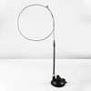 A black interactive chirping bird cat toy with a circular head and a long wire extending from it.