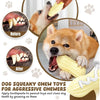 A dog is chewing a yellow peanut-shaped squeaky toy, demonstrating its use for dog teeth cleaning.