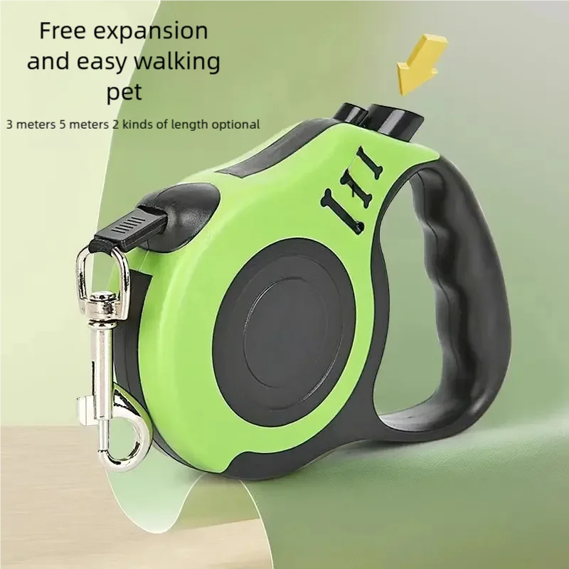 A lime green automatic retractable dog leash with a black handle and silver clip is shown on a light surface.