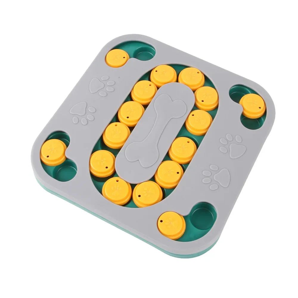 A gray puzzle feeder bowl with multiple compartments and yellow food balls for dogs and cats.