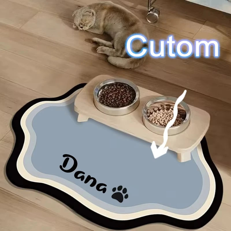 A pet feeding mat featuring a cute cat and dog paw print, used for feeding pet food.