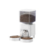 A white smart automatic pet feeder with a clear top, dispensing brown pet food into a bowl.