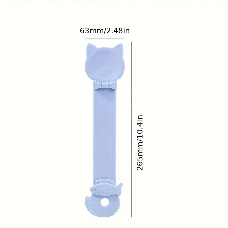 Cuchara para alimentar gatos de mango azul claro con lazo decorativo.