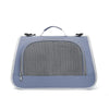 A light blue breathable pet carrier bag for cats and small dogs with a mesh front and carrying handles.
