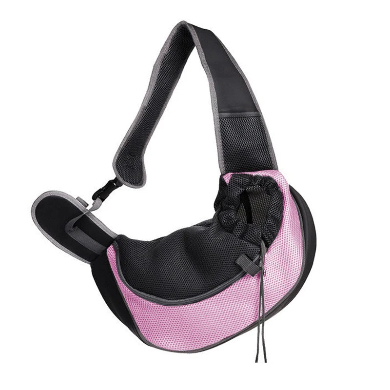 A black and pink breathable mesh pet carrier sling with adjustable straps.