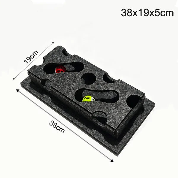 A black puzzle toy box with a maze tunnel and slots for a red and yellow ball.
