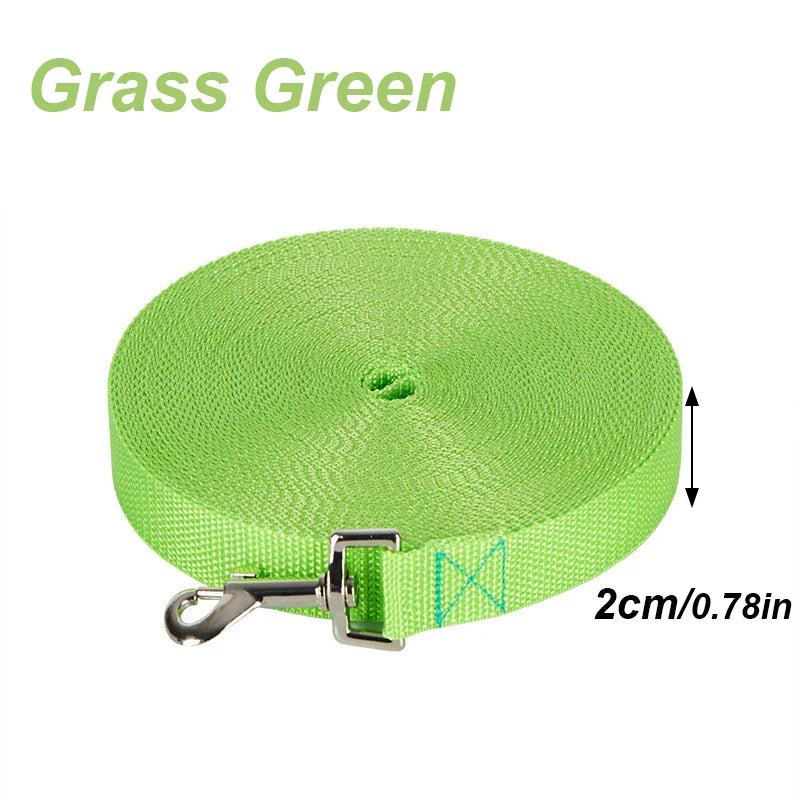 A round, lime green nylon dog training leash with a silver clip and a green textured strap.