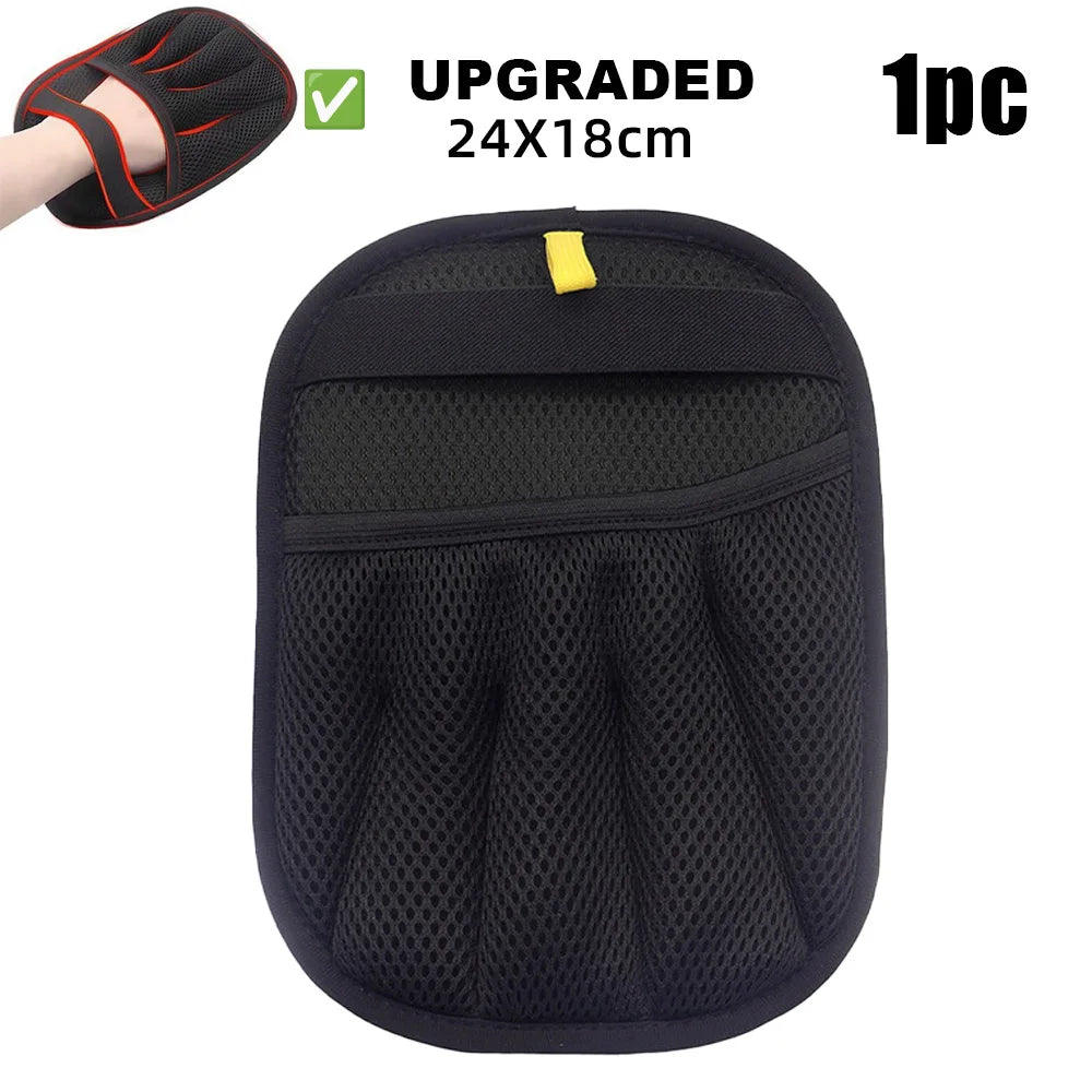 Black reusable pet grooming gloves with a mesh design and yellow tab