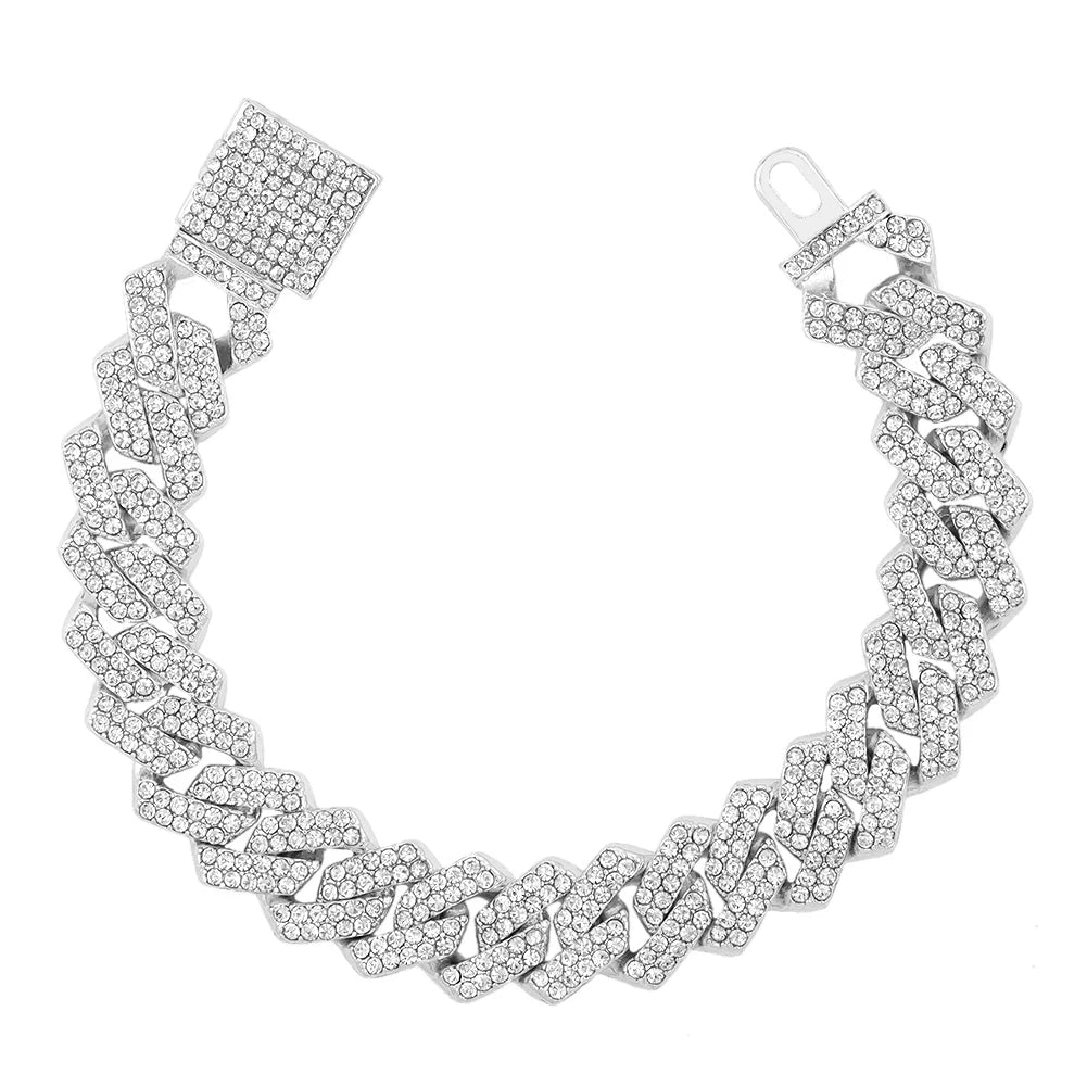 A silver iced-out Cuban link bracelet featuring rhinestone pavé detailing.