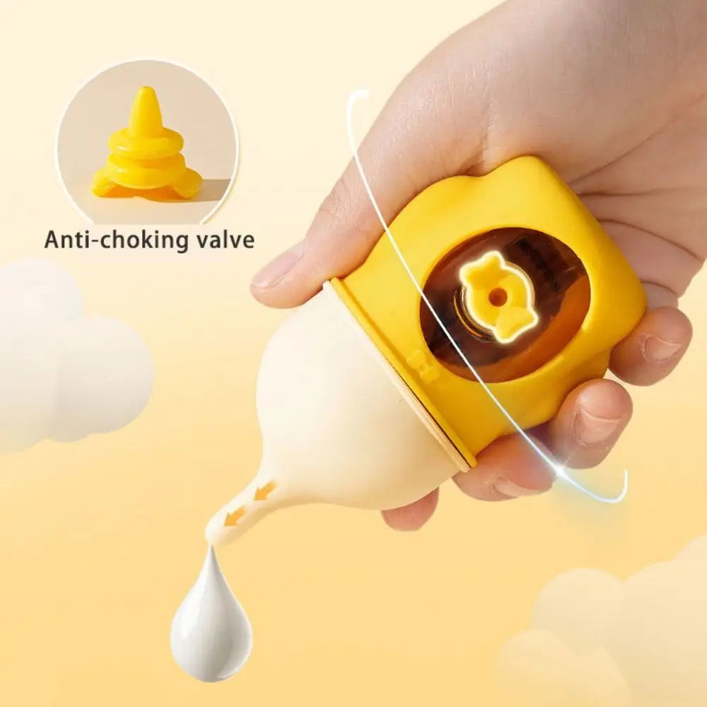 A hand is holding a yellow silicone pet nursing bottle with an anti-choking valve, demonstrating the feeding mechanism.