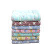 A stack of colorful plush fleece pet blankets and mats for dogs and cats.