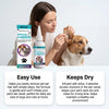 A woman is applying a powder product for pet ear removal to a dog's ear.