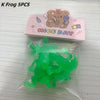 A pink box containing five green rubber frog bath toys packaged in a clear plastic bag.