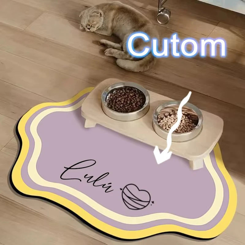 A pet feeding mat with a non-slip base features a cute design and holds pet food in glass bowls.