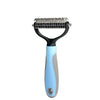 A light blue pet hair removal comb brush with a metal comb for dogs and cats.