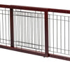 A dark brown wooden pet gate with vertical bars used for indoor use.