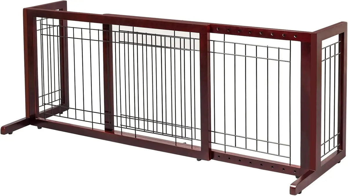 A dark brown wooden pet gate with vertical bars used for indoor use.
