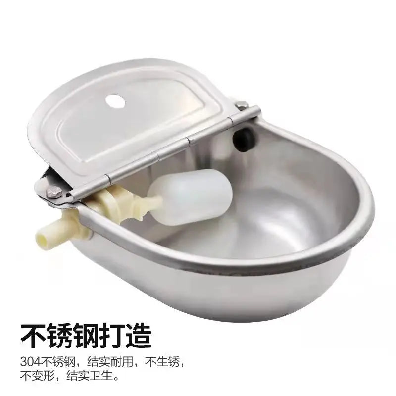 Silver automatic floating water bowl for livestock with a hinged lid and a floating cup.