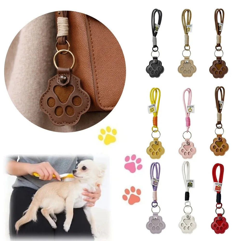 A refillable pet hair keychain with a cat paw charm shown next to a dog, featuring various colored leather and plastic charms
