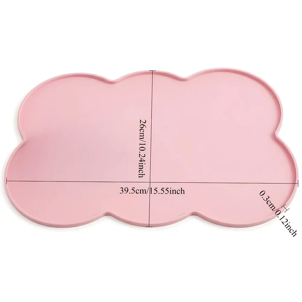 A pink waterproof silicone pet feeding mat with a raised edge, measuring 39.5cm by 26cm.