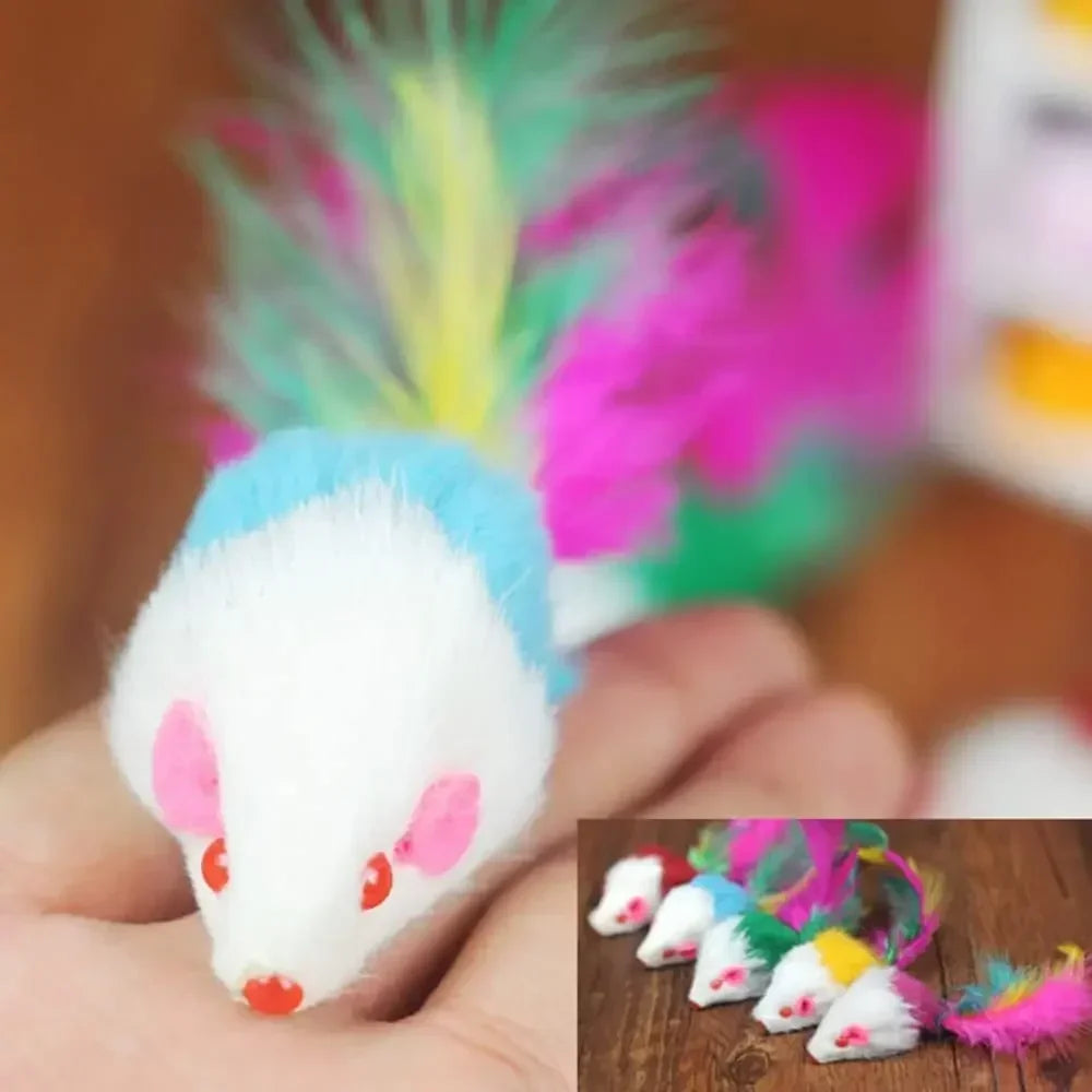 White and blue faux fur cat mice toys with rattles shown in a hand