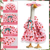 A cute porch goose outfit featuring a pink strawberry pattern dress with a wide-brimmed hat and lace trim.