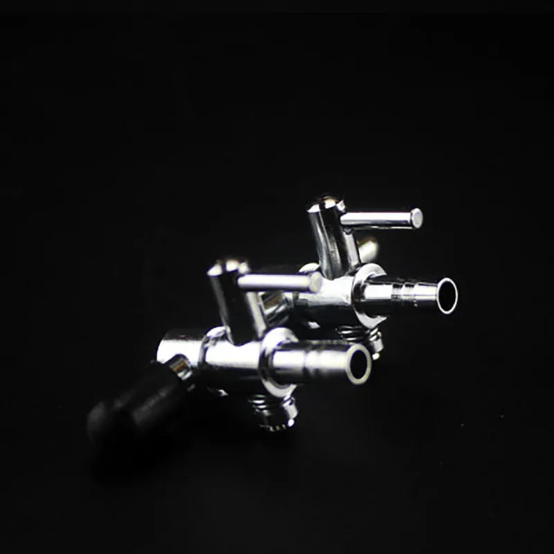 A silver 5-way aquarium air flow splitter valve with multiple outlets.