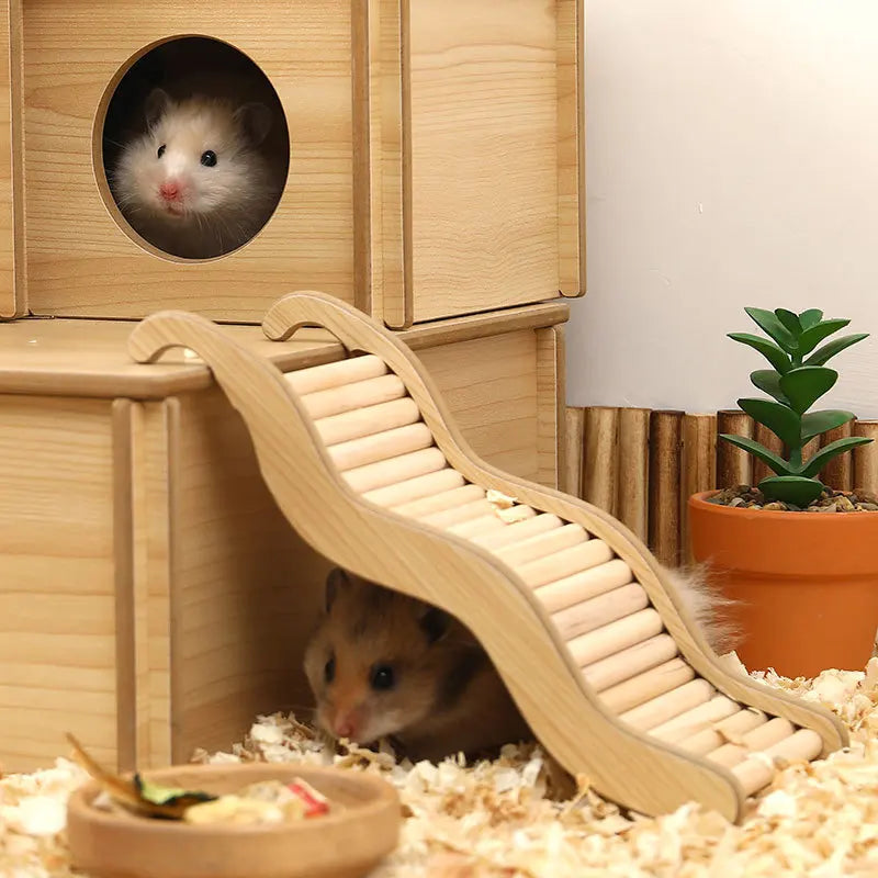A wooden wave staircase hamster toy with a curved slide is shown next to a wooden box and a hamster.