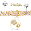 Gold iced out Cuban link chain necklace with rhombus diamond accents featuring a secure clasp.