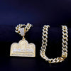 A gold plated last supper medallion pendant and a matching Cuban chain necklace displayed against a dark background.