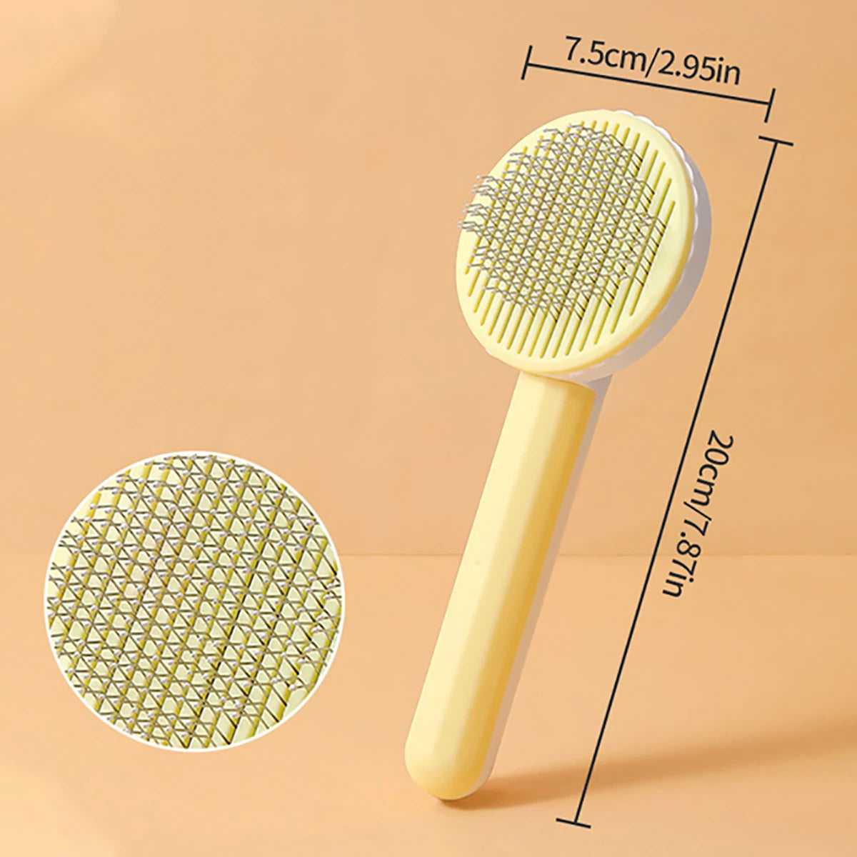 A yellow self-cleaning pet grooming brush with a textured silicone head and handle shown against a light background.