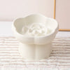 White ceramic slow feeder bowl for pets featuring an anti-vomiting flower design.