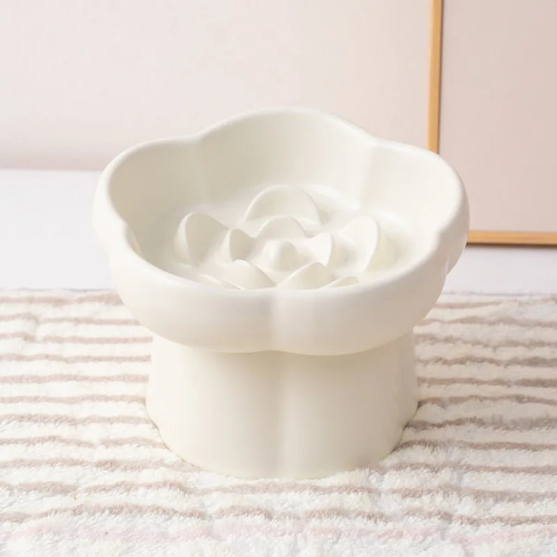 White ceramic slow feeder bowl for pets featuring an anti-vomiting flower design.