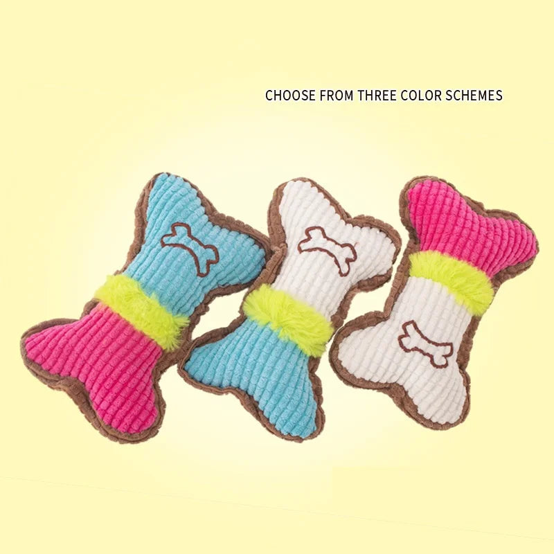 Three plush squeaky bone dog toys in pink, blue, and white color schemes displayed on a light background.