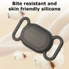 A black silicone protective case for a pet tracker is shown being held by a hand, with cotton balls in the background.