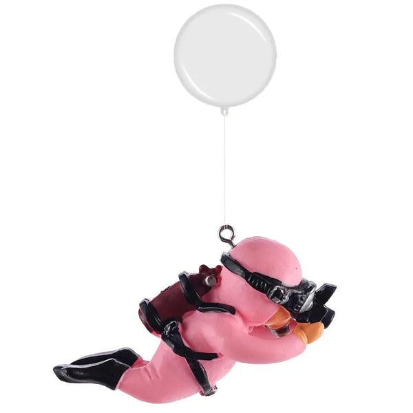 A pink resin mini diver aquarium ornament is suspended by a white balloon string.