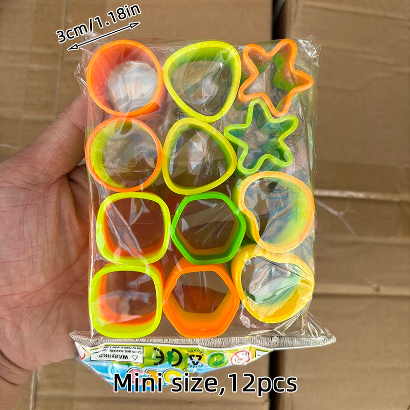 A clear plastic bag containing twelve colorful spring coil toys in various shapes and colors