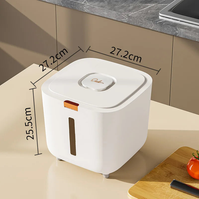 A white airtight pet food storage bucket with a lid and an orange-colored opening, shown on a countertop.