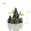 A resin aquarium rockery featuring a cave structure and small green trees, shown with size measurements.