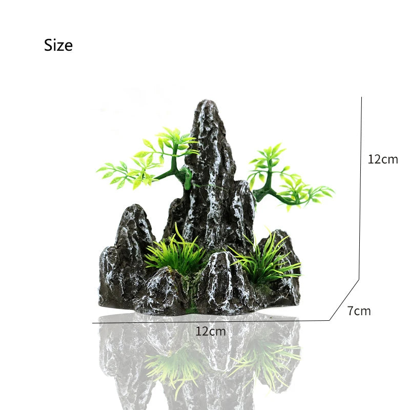 A resin aquarium rockery featuring a cave structure and small green trees, shown with size measurements.