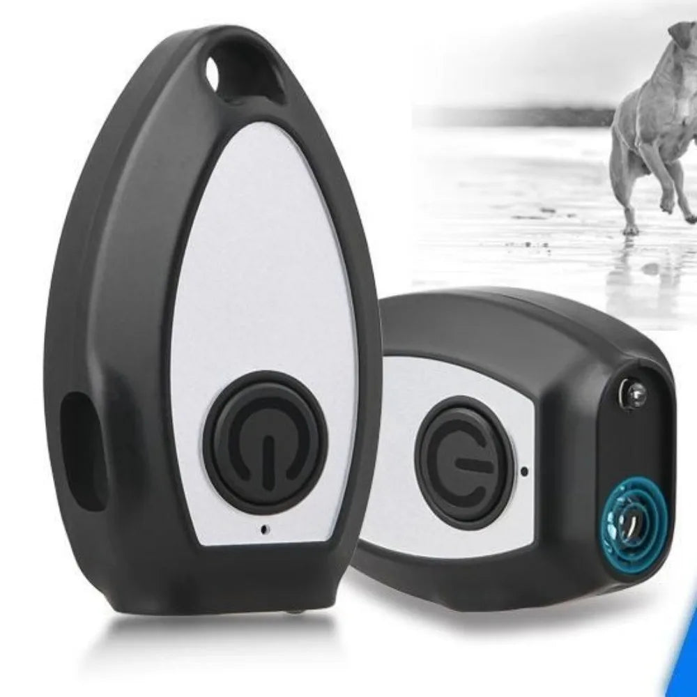 A black and white handheld ultrasonic dog bark deterrent device is shown against a light background.