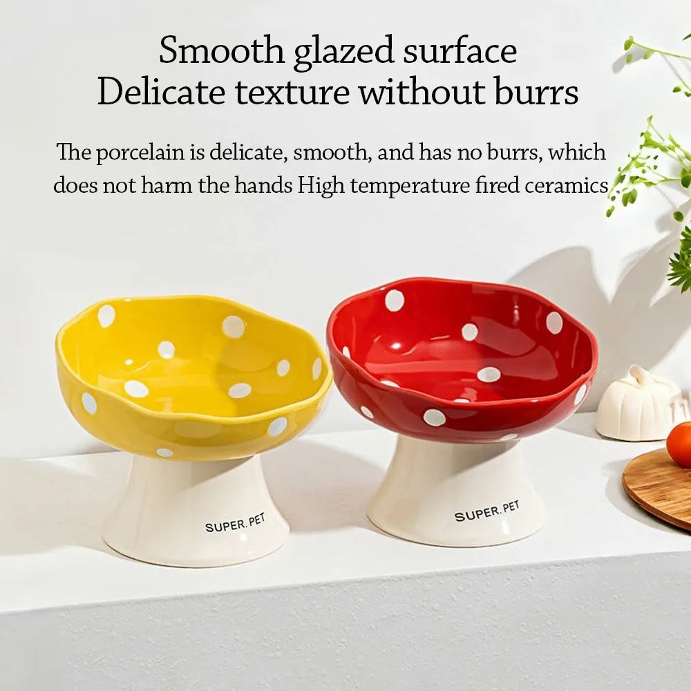 Two ceramic pet bowls, one yellow and one red, are displayed on a white surface.