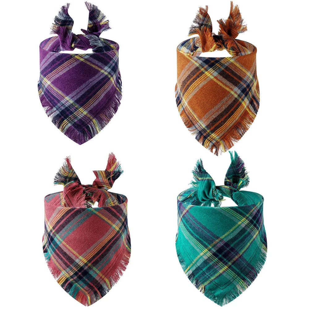 Four buffalo plaid dog and cat bandanas in purple, orange, maroon, and teal colors.