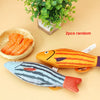 Two random interactive catnip fish toys, one orange and one blue, displayed on a light background.