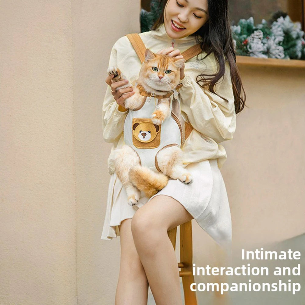 A young woman is holding a fluffy orange tabby cat in a breathable mesh carrier backpack.