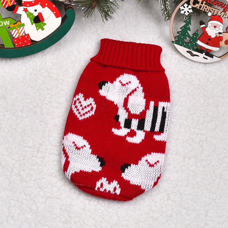 A knitted red sweater featuring a white dog pattern and heart designs, displayed on a white background.