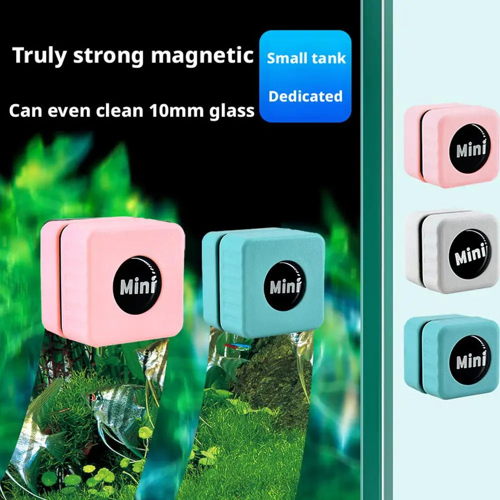 Pink and blue magnetic cleaning tanks for aquarium glass shown in a natural, green environment.