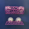 A pink acrylic aquarium tunnel hideout with multiple spherical openings for fish and shrimp.