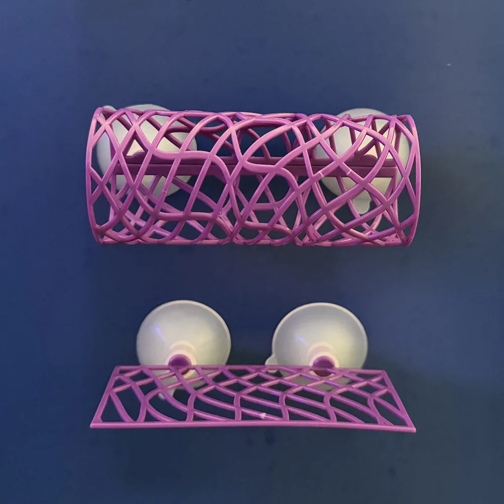 A pink acrylic aquarium tunnel hideout with multiple spherical openings for fish and shrimp.